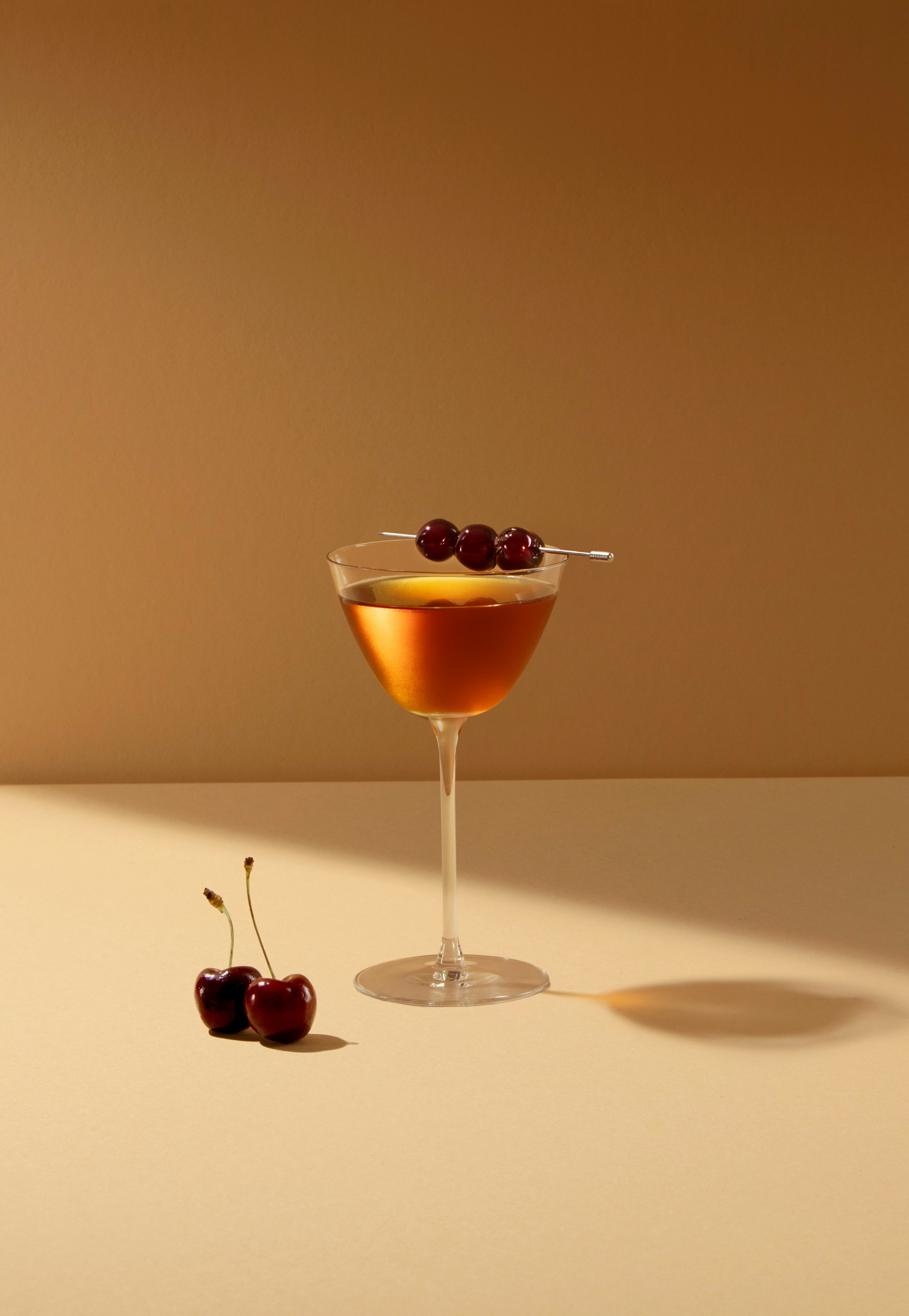 Image of a glass of Whisky cocktail with cherries